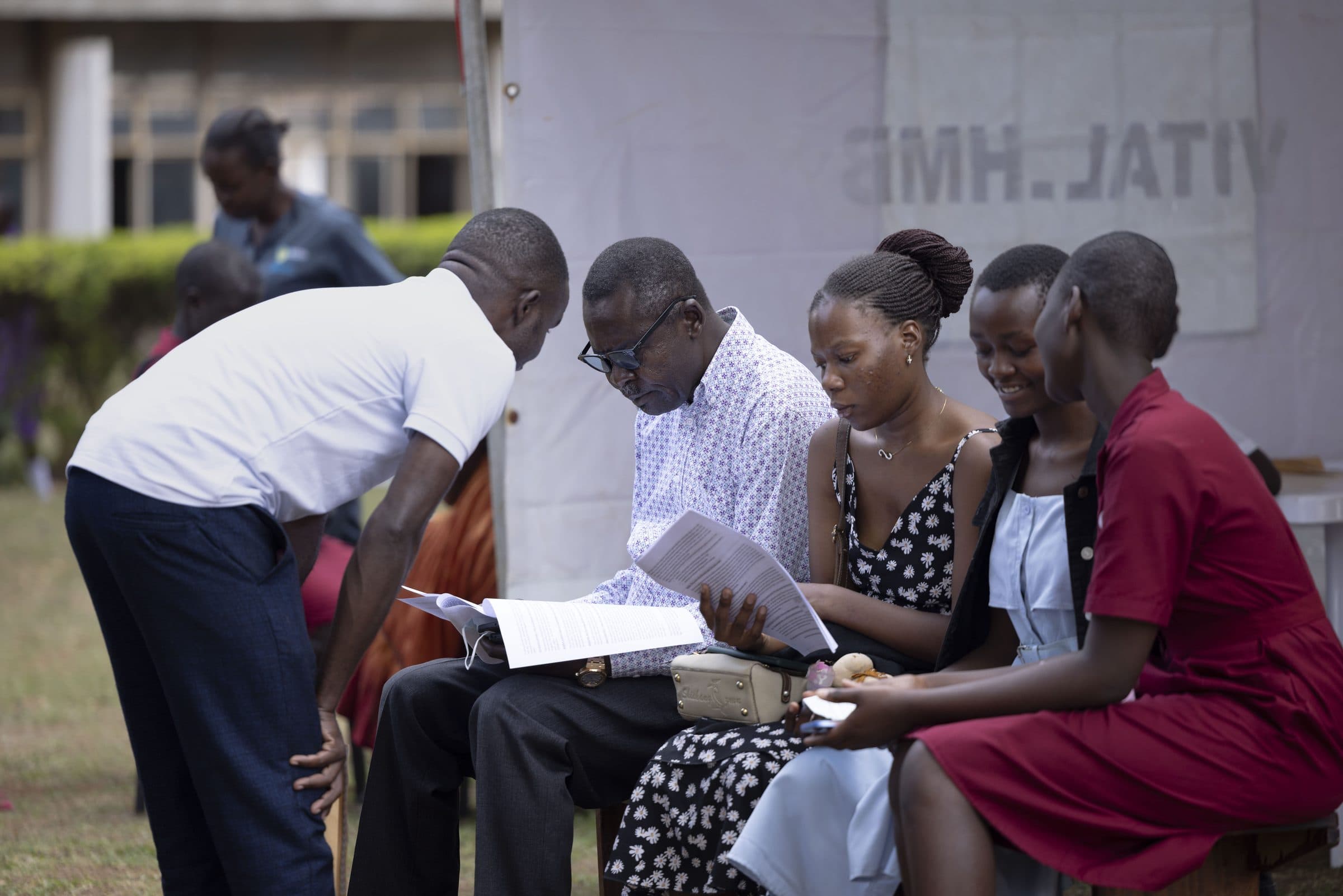 Walking a family through study consent at a community enrolment day